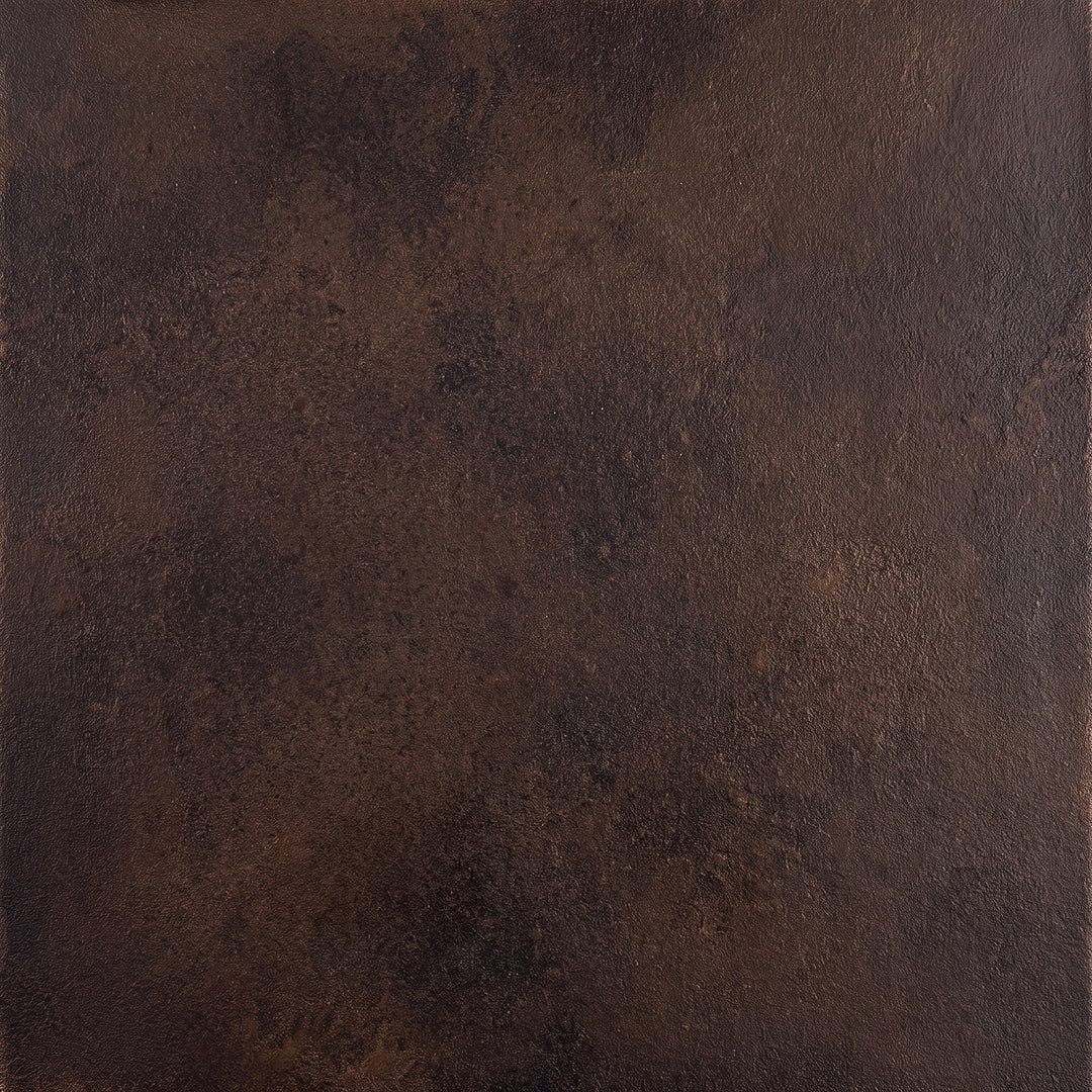 Aged Iron with Gold finish showing a dark wrought iron base with warm gold highlights emphasizing edges and surface texture.
