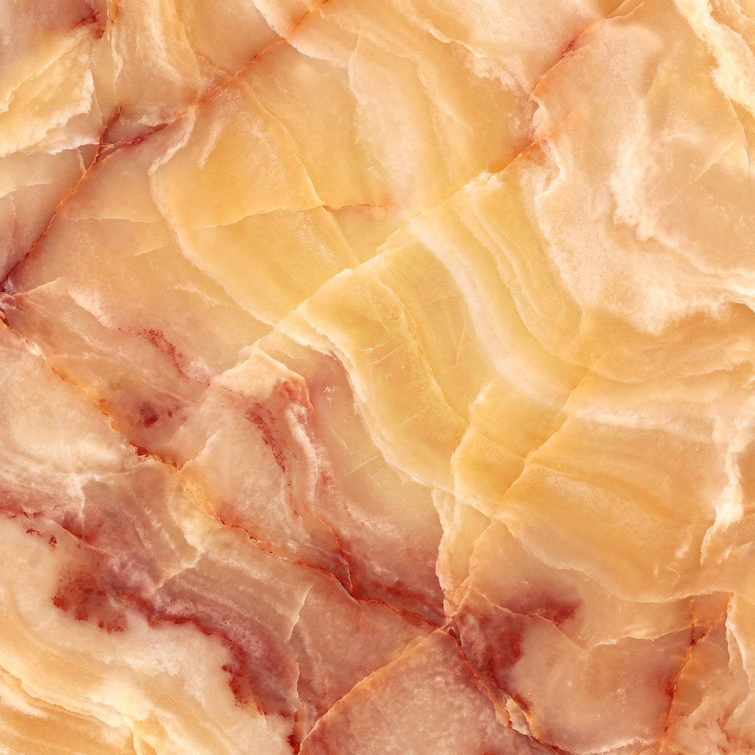 Amber with Red Veining natural alabaster illuminated for designer lighting with warm translucency and pronounced mineral bands and veining.