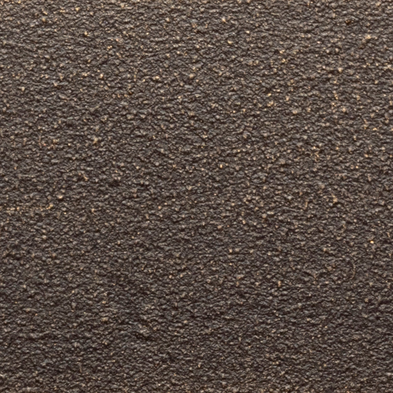 Bronze wrought iron lighting finish showing deep brown undertones, dark recesses, and understated hand-applied surface variation.