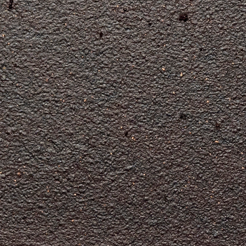 Rust wrought iron lighting finish showing earthy reddish-brown tones and naturally aged variation across textured iron.