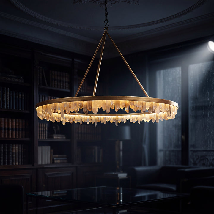 Bailey single-tier quartz chandelier shown illuminated in a dark interior, with a circular iron frame and glowing natural quartz crystal perimeter.