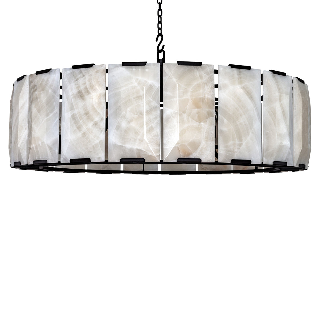 Calcite architectural chandelier with illuminated natural-stone panels arranged around a circular dark iron frame and suspended by chain.