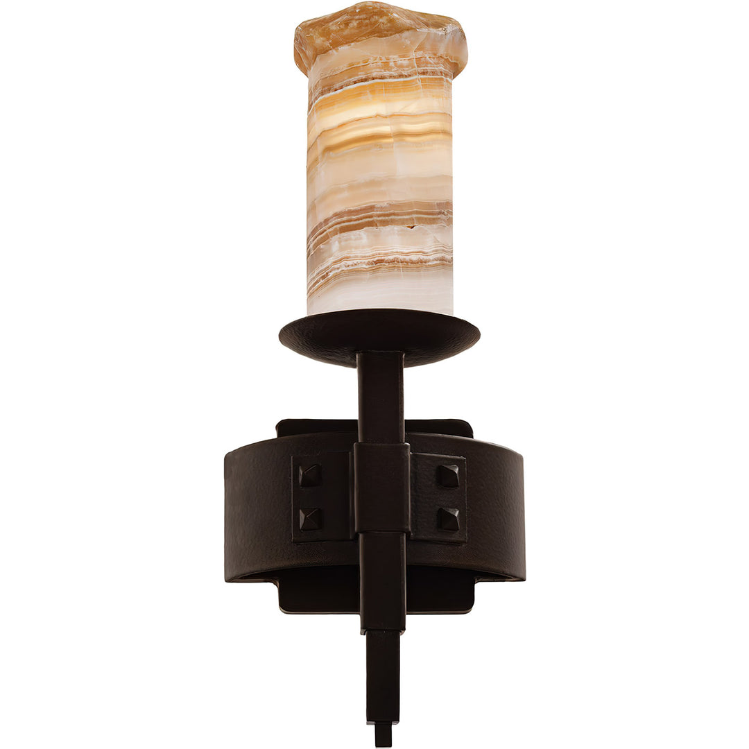Craftsman one-light wrought iron wall sconce with riveted iron backplate, vertical arm, and natural alabaster shade.