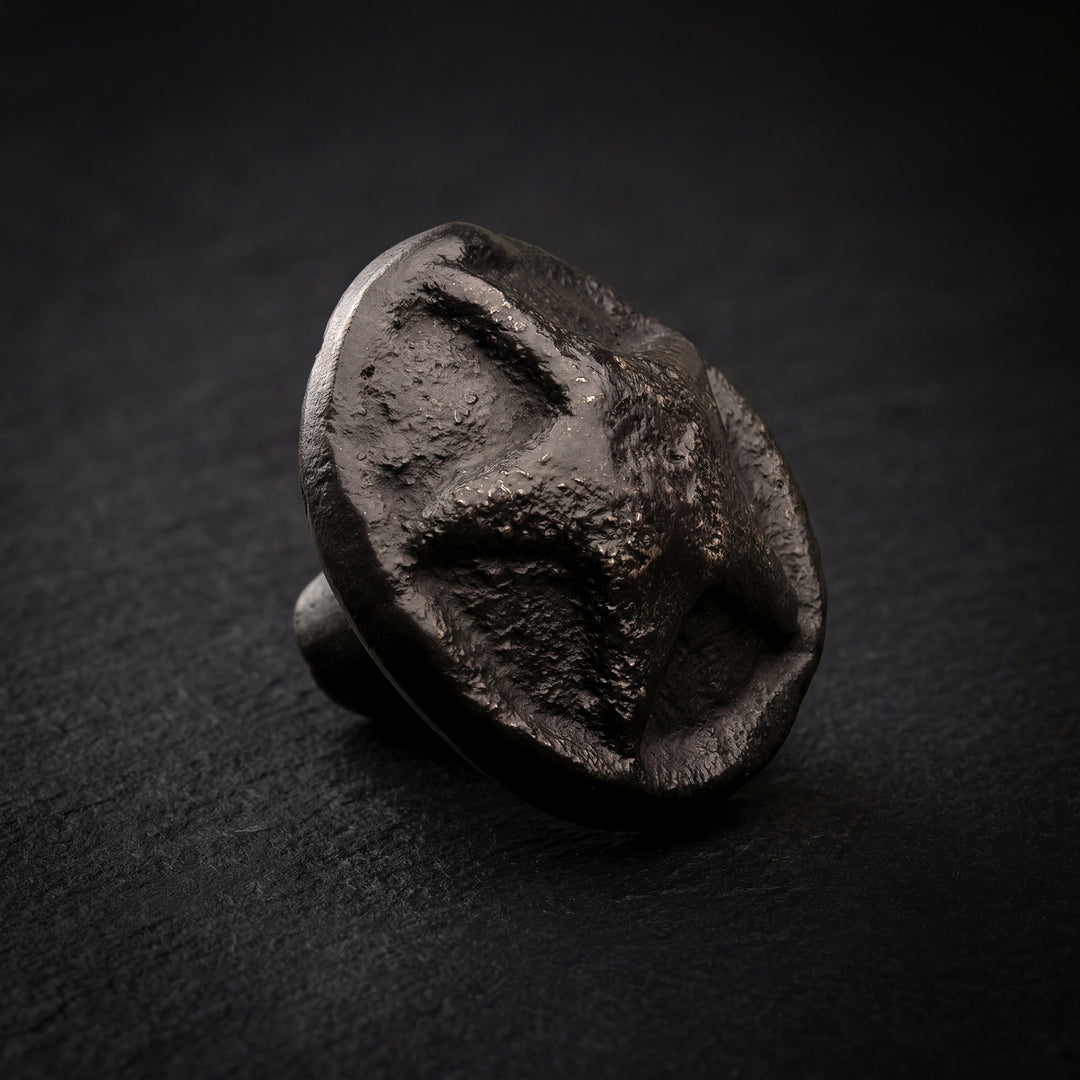 Lyra handcast bronze star relief cabinet knob in solid bronze hardware with recessed star design and textured surface