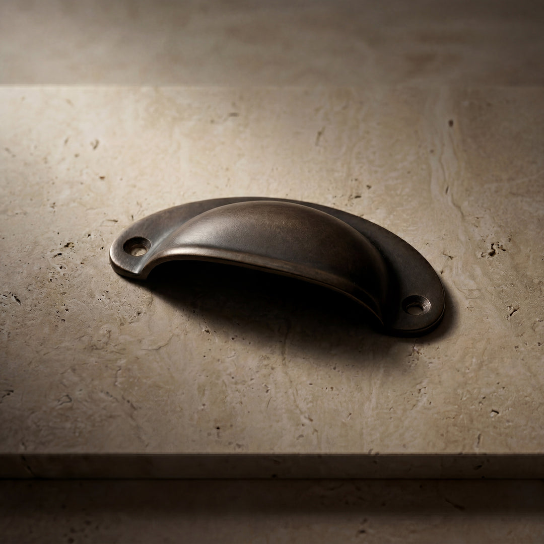 Mercer handcast bronze rounded cabinet pull in solid bronze hardware, artisan made in Dallas with natural patina and substantial weight