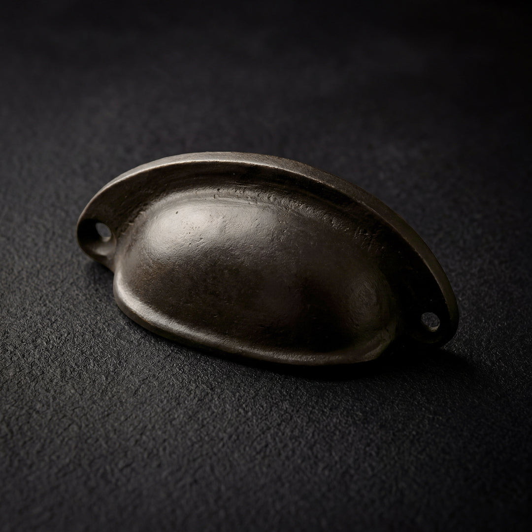 Mercer handcast bronze rounded cabinet pull in solid bronze hardware, artisan made in Dallas with natural patina and substantial weight