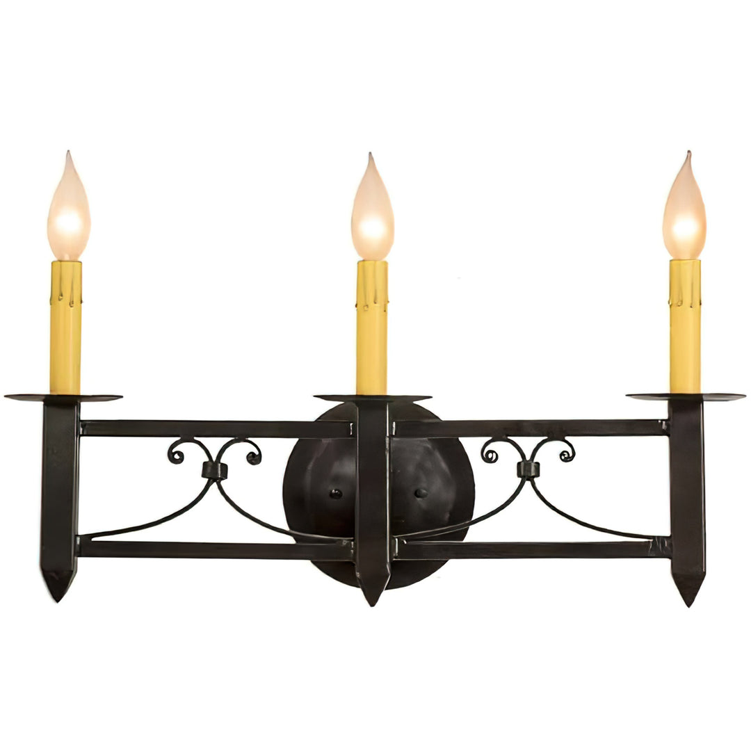 Mission Forge three-light wrought iron wall sconce with Spanish Colonial scrollwork, pointed terminals, circular backplate, and candle-style lights.