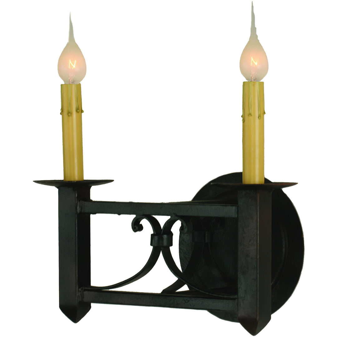 Mission Forge two-light wrought iron wall sconce with Spanish Colonial scrollwork, pointed terminals, circular backplate, and candle-style lights.
