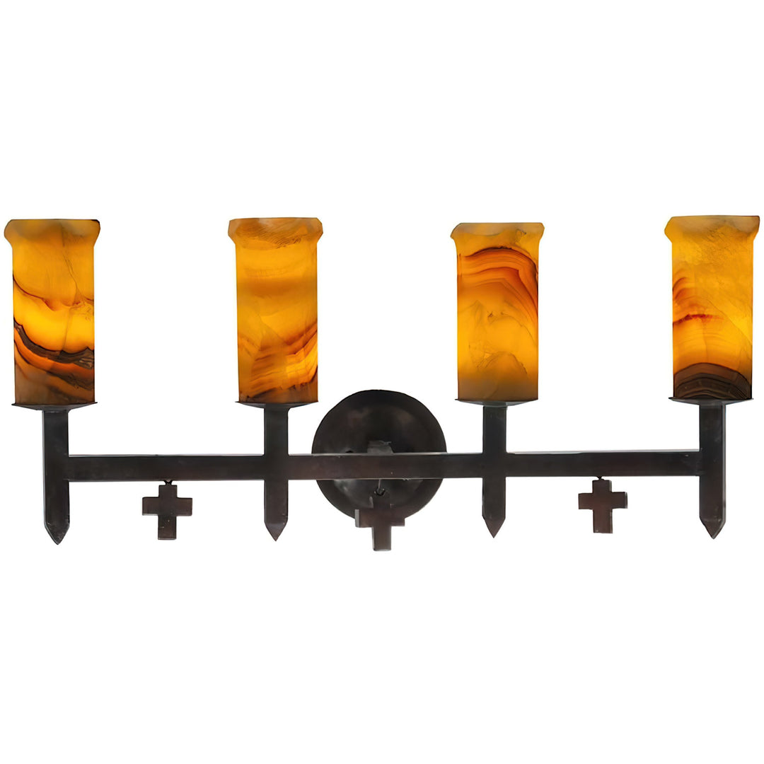Mission four-light alabaster vanity shown in Amber with Red Veining stone with pointed iron details, circular backplate, and suspended mini crosses.