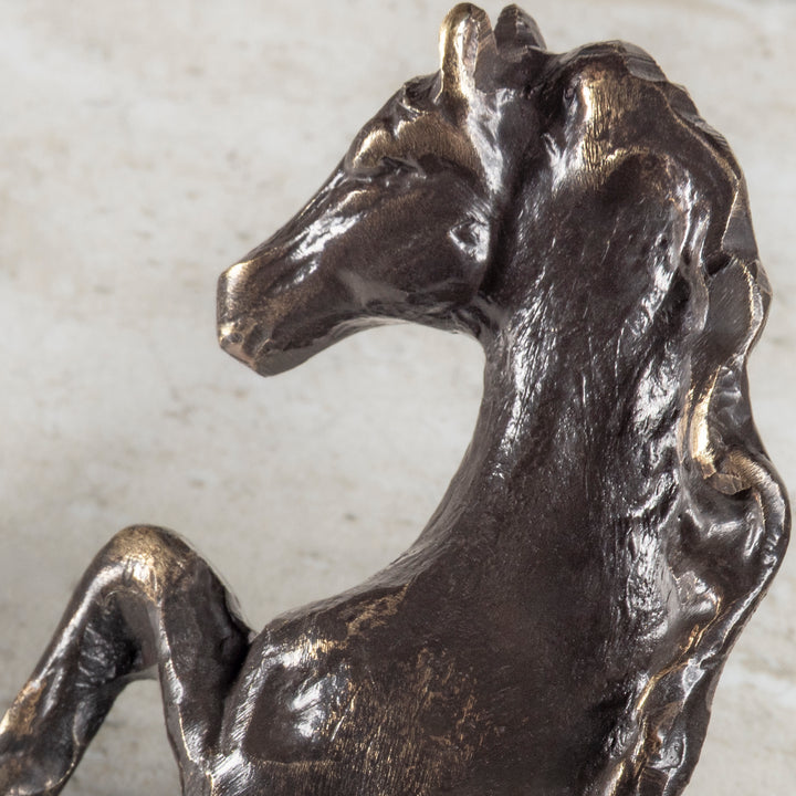 Closeup of bronze horse cabinet hardware pull with detailed mane and raised leg