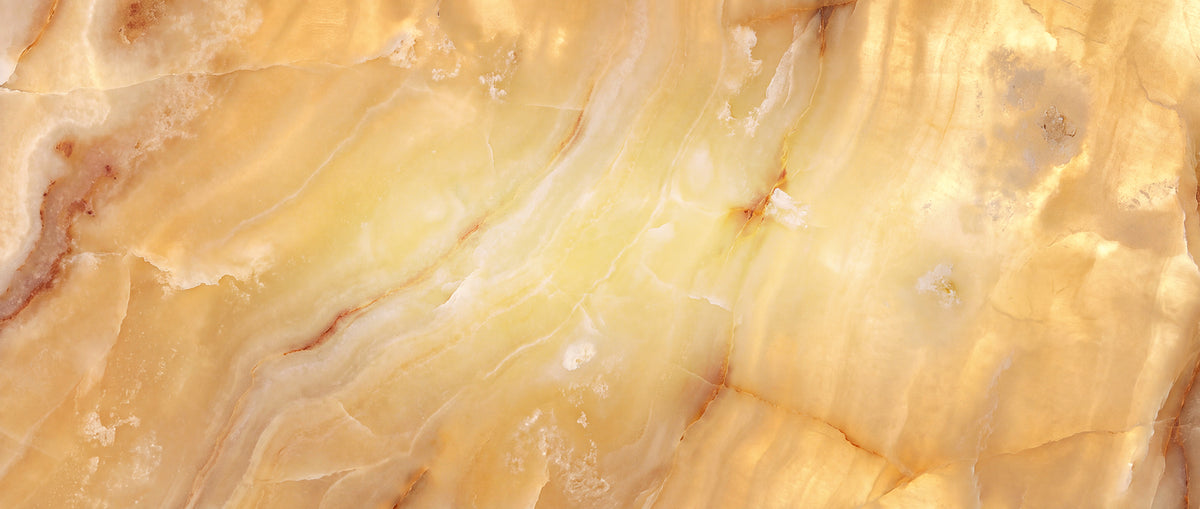 Four natural alabaster color selections for Ashore Lighting fixtures, showing variations in warmth, veining, mineral pattern, and translucency.