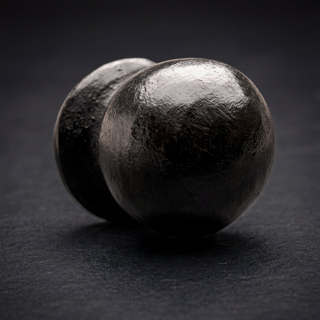 Orion handcast bronze rounded cabinet knob in solid bronze hardware with spherical form and natural patina
