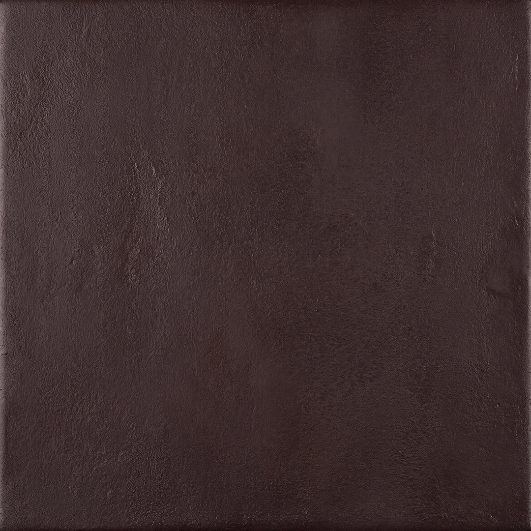 Rust hand-applied wrought iron lighting finish showing warm earthy coloration, aged character, and dimensional surface texture.