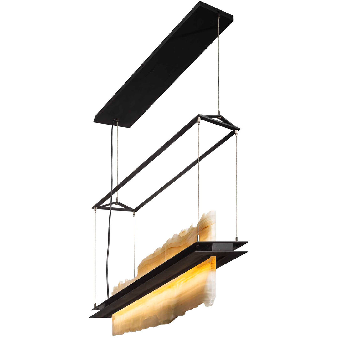 Stone Float linear alabaster chandelier with luminous irregular stone panels, an open wrought iron frame, and slender cable suspension.