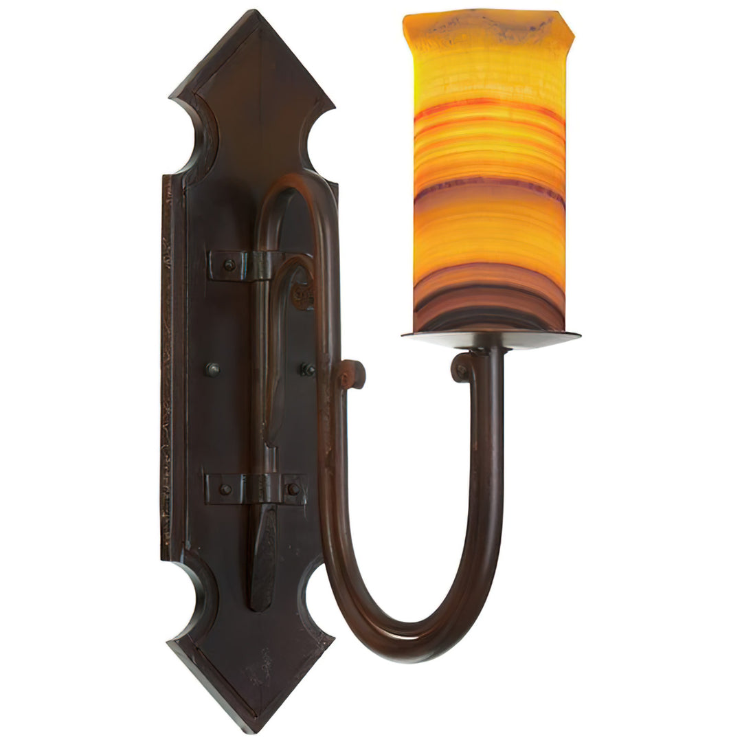 Trevi architectural alabaster wall sconce with a sculptural iron backplate, sweeping curved arm, and illuminated natural stone shade.