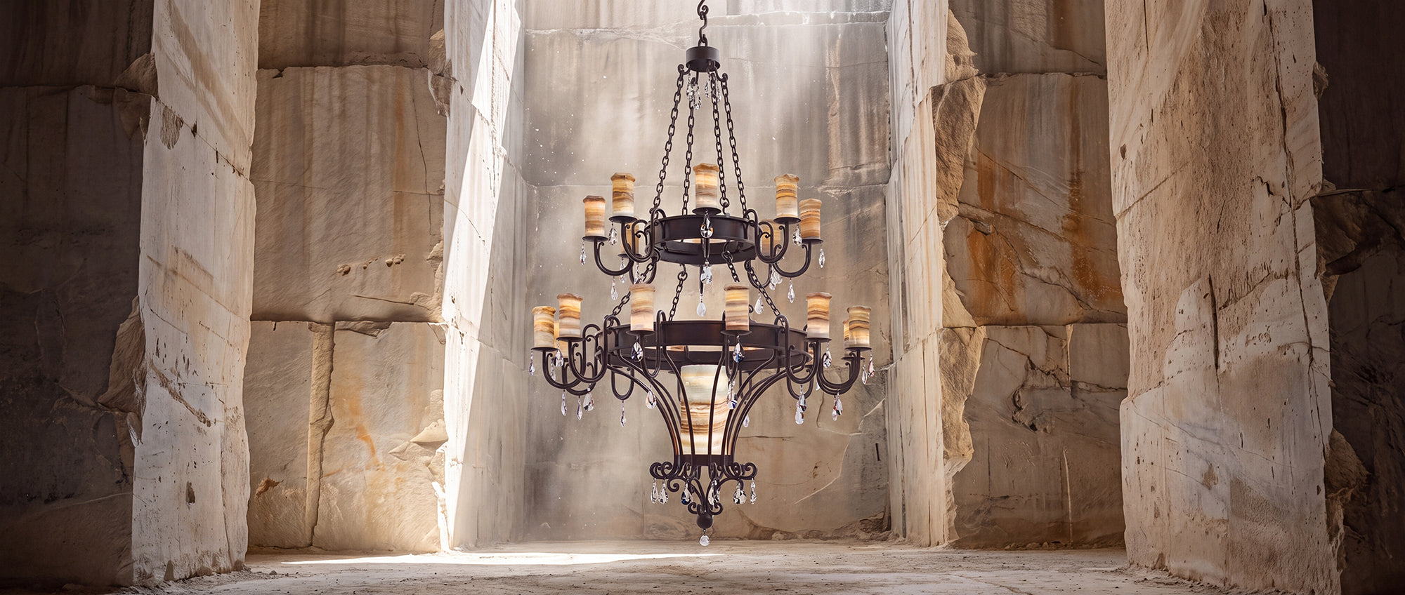 Trevi heirloom two-tier alabaster chandelier with sculptural ironwork, luminous natural stone shades, and suspended faceted crystal accents.