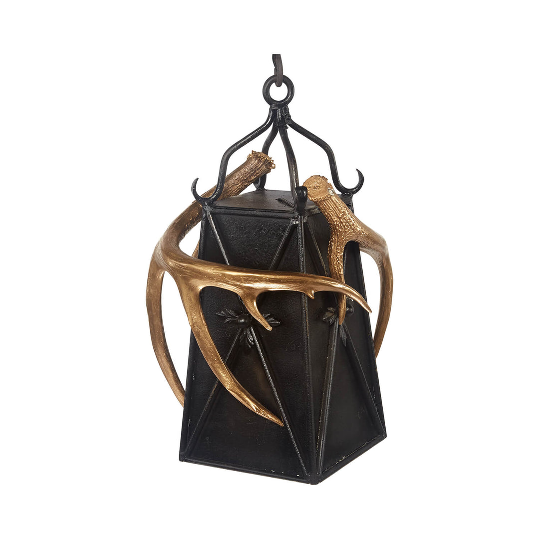 wrought iron antler pendant light with lantern design, handcrafted lighting featuring natural antlers and forged iron structure